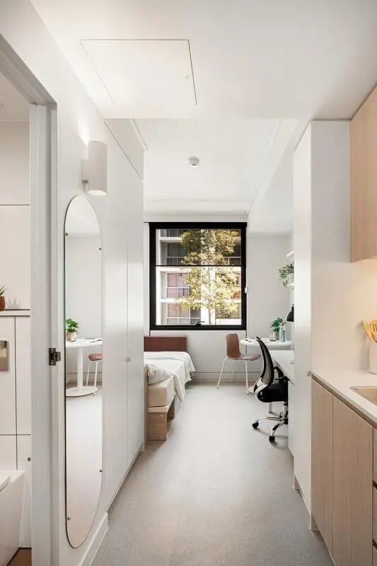 Bed desk chair and mirror studio apartment at Iglu Mascot in Sydney Student Accommodation