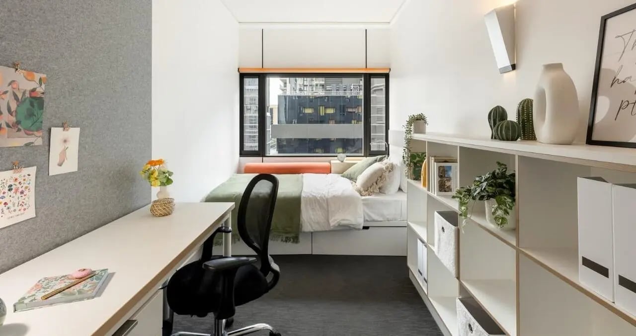 Desk bed chair shelves plants bedroom at Iglu Brisbane City in Brisbane Student Accommodation