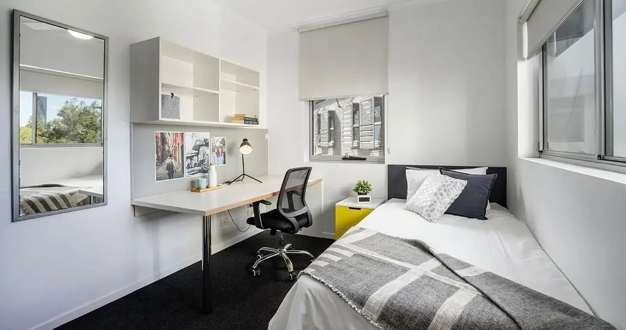 Bed desk chair shelf mirror bedroom study area at Iglu Kelvin Grove in Brisbane Student Accommodation