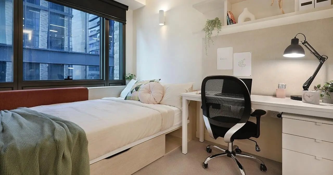 Bed with desk and chair bedroom at Iglu Melbourne Central in Melbourne Student Accommodation