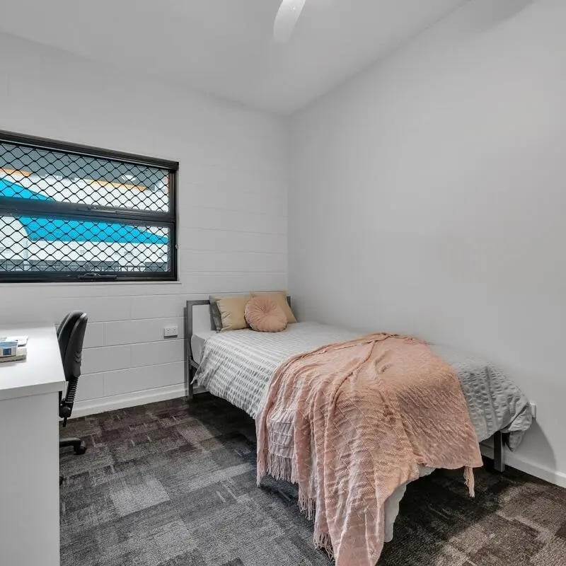 Single bed desk chair study area bedroom at Western Sydney University Village Parramatta Campus in Sydney Student Accommodation