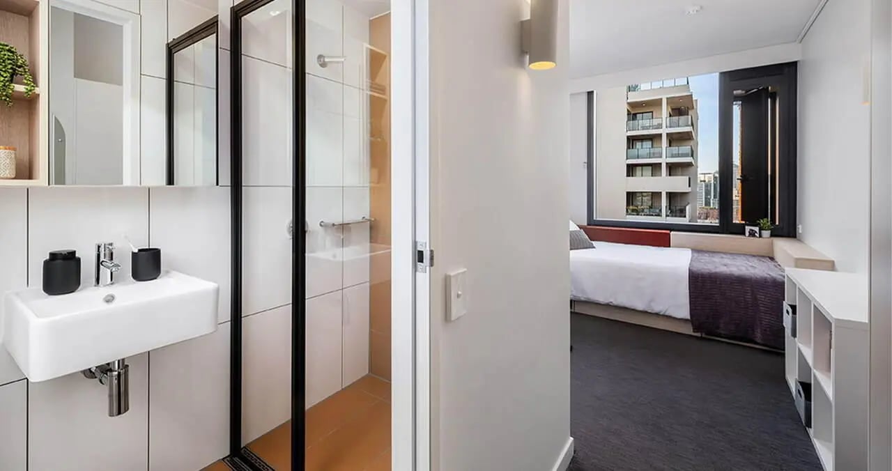 Sink shower bed shelves bedroom bathroom at Iglu Redfern in Sydney Student Accommodation