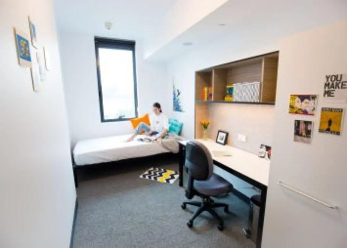 Bed desk and chair in student room bedroom at UniLodge Park Central in Brisbane Student Accommodation