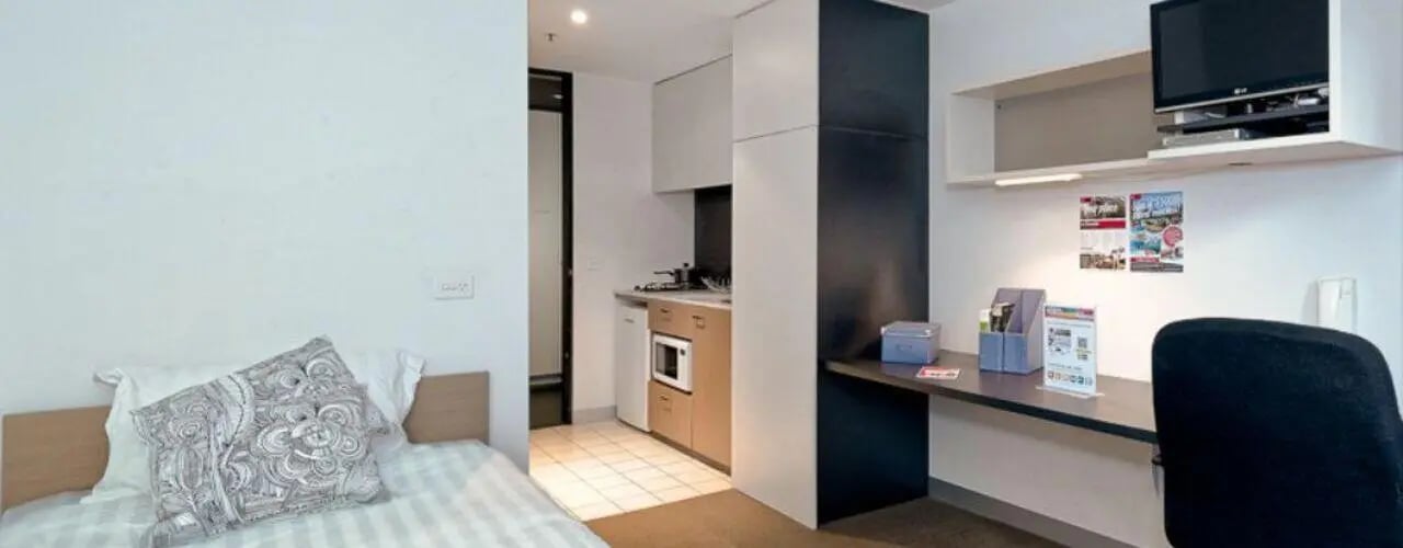 Bed kitchen desk chair and TV study area at Student Living on Riversdale in Melbourne Student Accommodation