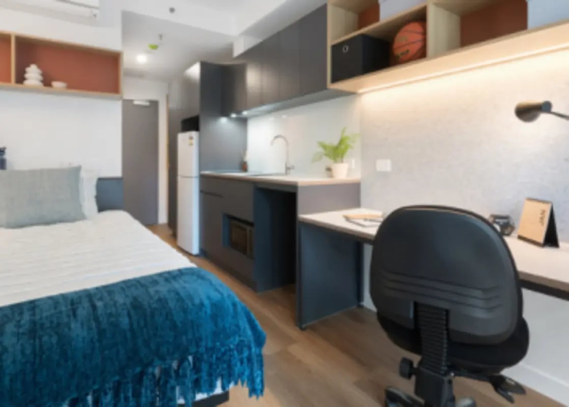 Bed desk kitchen and appliances studio apartment at UniLodge Melbourne Central in Melbourne Student Accommodation