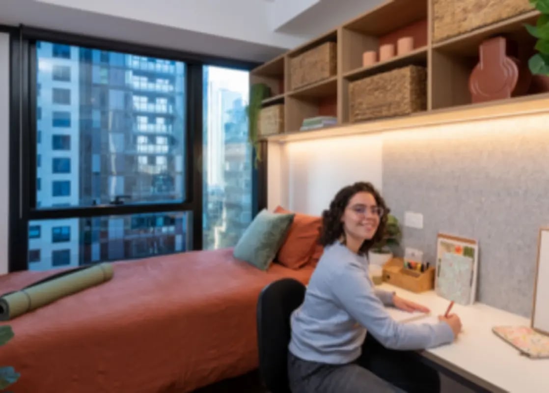 Bed yoga mat desk with student study area at UniLodge Melbourne Central in Melbourne Student Accommodation