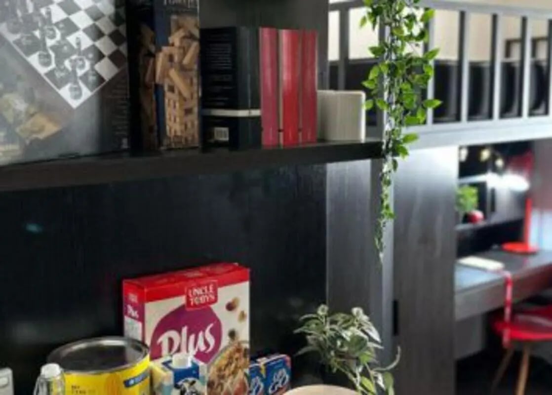 Chess Jenga boxes red plant study area living room at UniLodge Carlton in Melbourne Student Accommodation