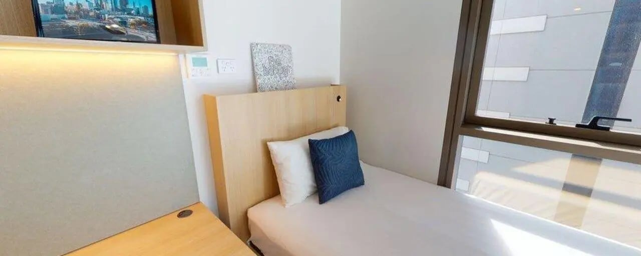 Bed desk and window Bedroom at Unilodge Melbourne City in Melbourne Student Accommodation