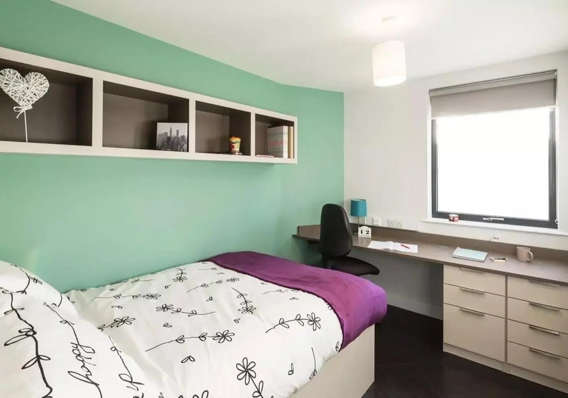 Bed desk shelves window drawers bedroom at iQ Twerton Mill in Bath Student Accommodation