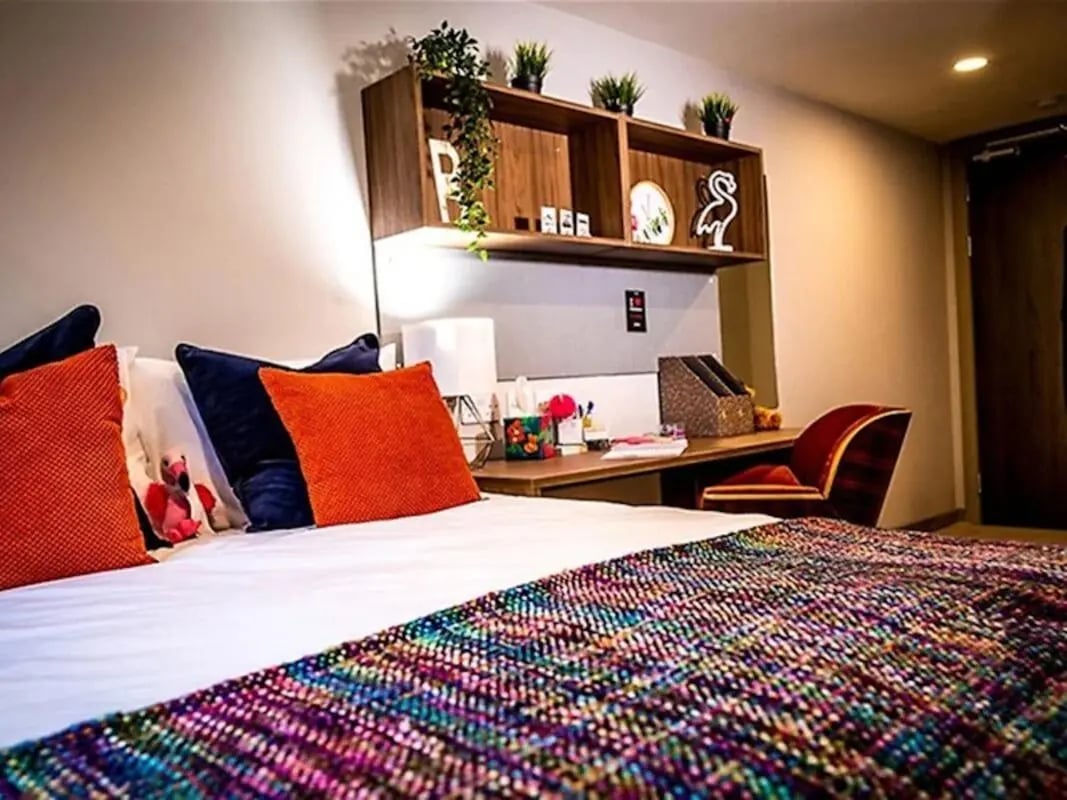 Bed pillows desk chair shelf decor bedroom at Scotway House in Glasgow Student Accommodation
