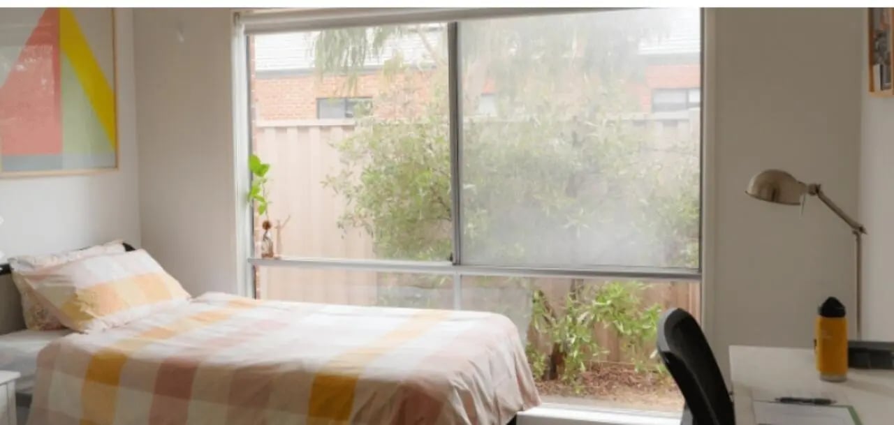 Bed desk lamp and plants bedroom interior at La Trobe University Regional Housing - Ballarat in Melbourne Student Accommodation