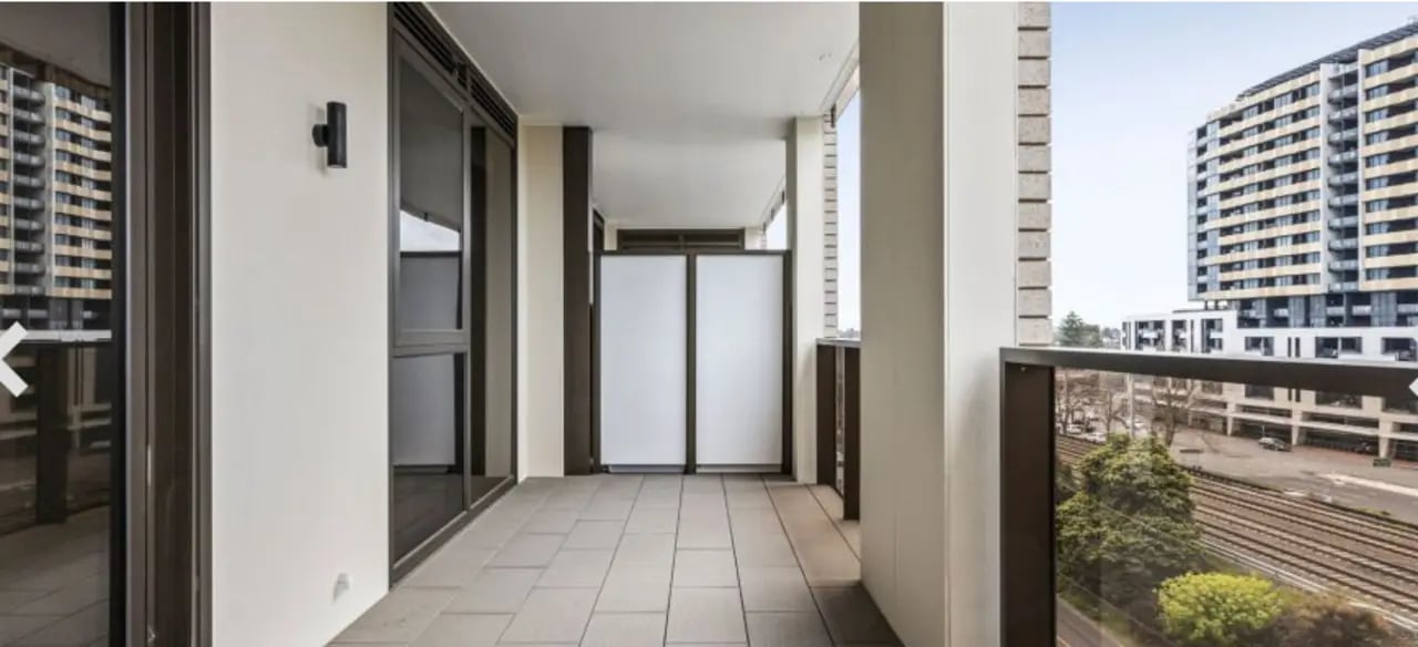 Balcony with glass doors and city view Balcony at Realm Caulfield in Melbourne Student Accommodation