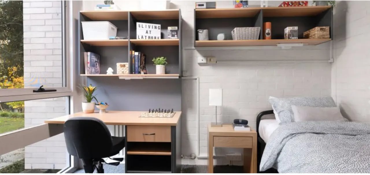 Desk chair bed shelves and window student bedroom at La Trobe University - Menzies College in Melbourne Student Accommodation