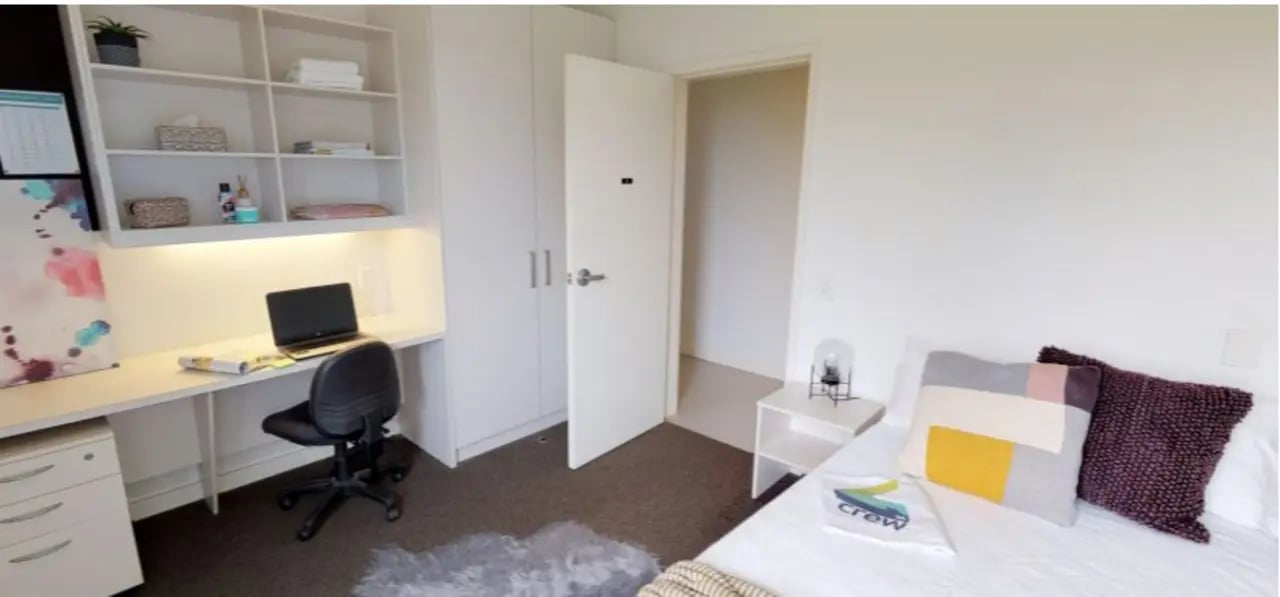 Desk with laptop chair and shelves bedroom at Western Sydney University Hawkesbury Village in Sydney Student Accommodation