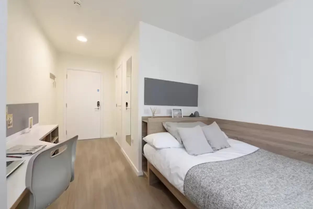 Bed desk chair and door bedroom at St Mungo's in Glasgow Student Accommodation