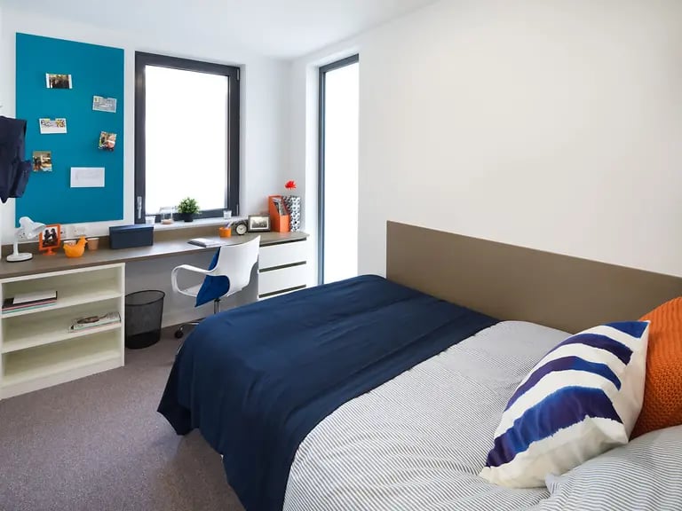 Bed desk shelves chair and window bedroom at Grand Felda House in Wembley Student Accommodation