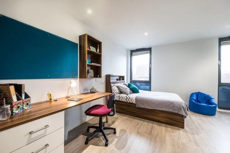 Desk bed blue beanbag shelf study area bedroom at Central Studios Reading in Reading Student Accommodation