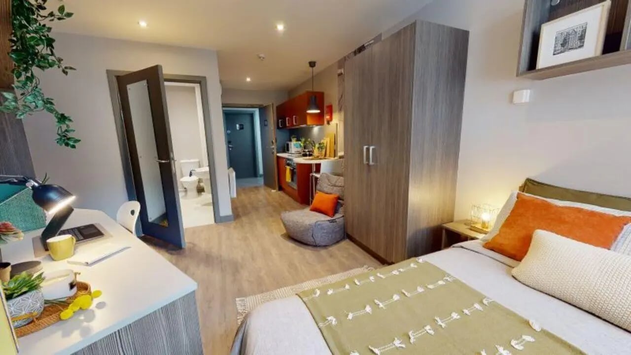 Desk bed chair kitchen and toilet studio apartment at Waterlane House in Bristol Student Accommodation