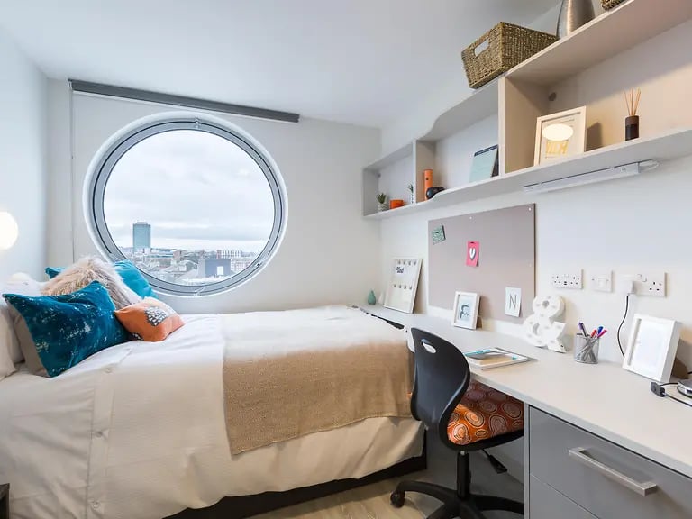 Bed desk and shelves bedroom at Livin Cardiff in Cardiff Student Accommodation