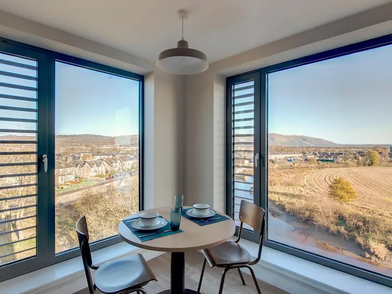 Table chairs and place settings dining area at Riverside Quay in Stirling Student Accommodation