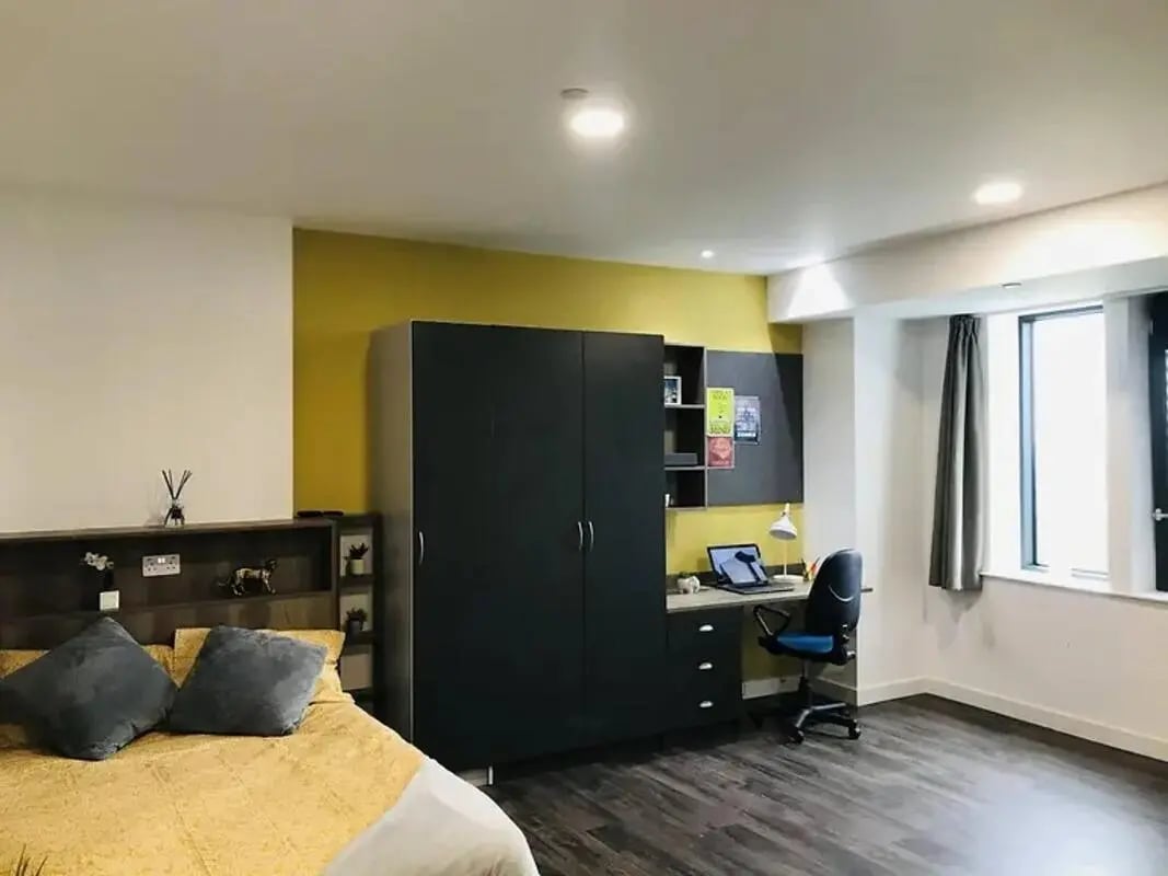 Bed wardrobe desk and chair bedroom study area at Yugo Catherine House in Portsmouth Student Accommodation