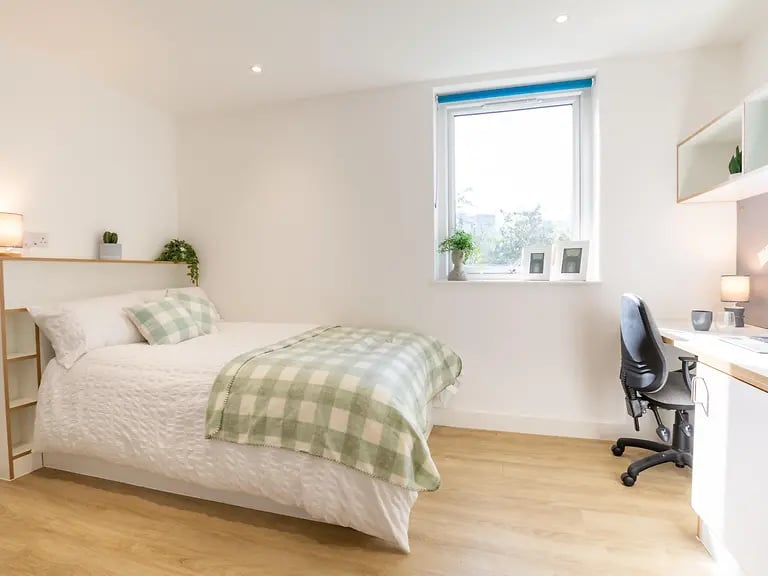Bed desk and chair student bedroom at Elmstead Place in Colchester Student Accommodation