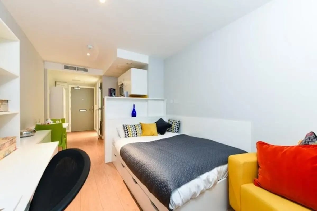 Bed desk chair and sofa student studio apartment at Merchant Studios in Glasgow Student Accommodation