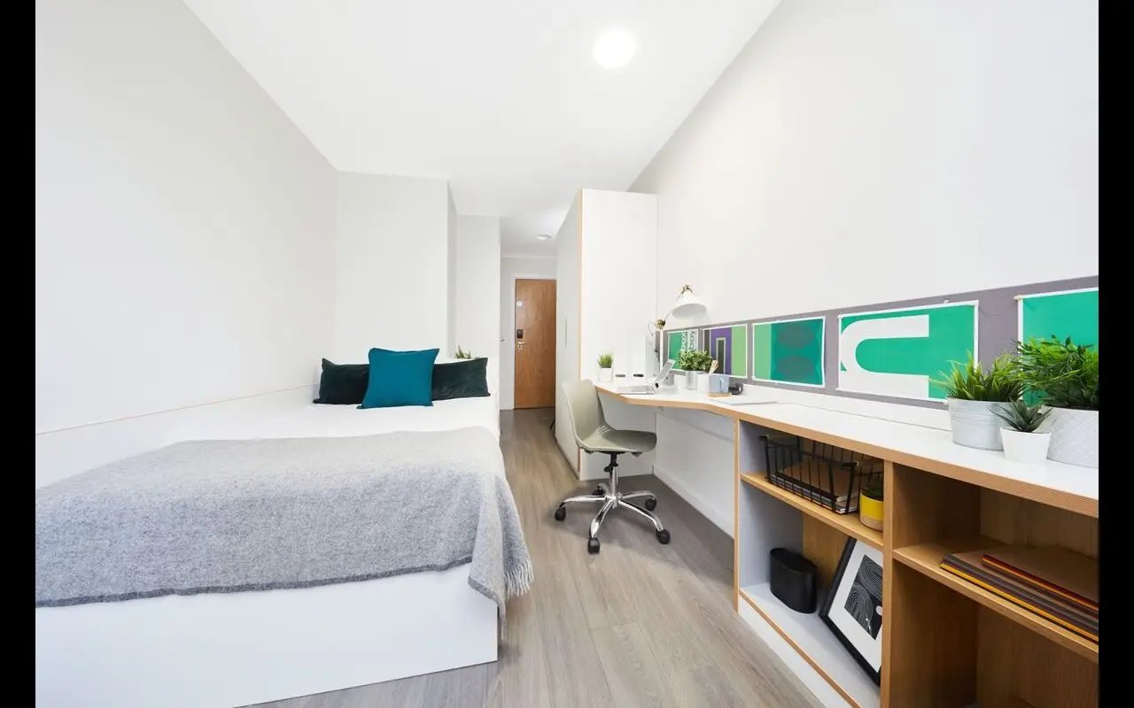 Bed desk chair shelves and decor Bedroom at Collegiate Merlin Heights in Leicester Student Accommodation