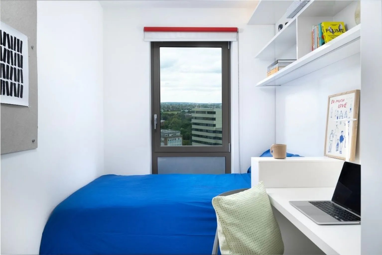 Bed desk laptop artwork and shelves bedroom at Scape Wembley in London Student Accommodation