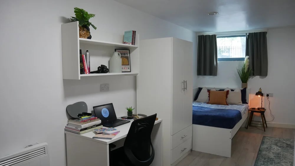 Desk laptop bed wardrobe and shelf bedroom at Theatre House in Coventry Student Accommodation