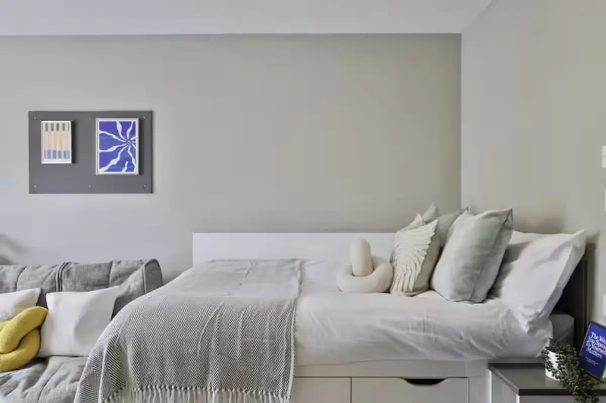Bed sofa with art pictures bedroom at Trippet Lane in Sheffield Student Accommodation