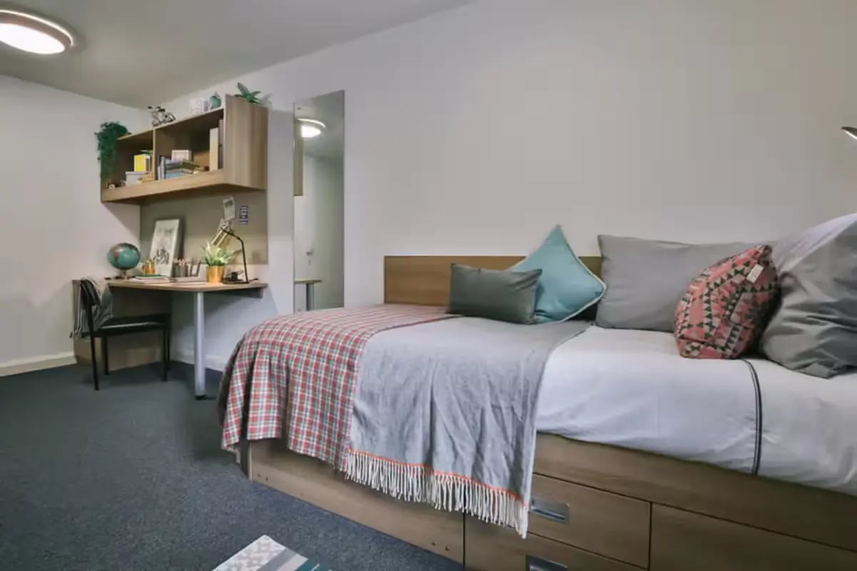 Bed desk shelves and chair student bedroom at Victoria Court in Lancaster Student Accommodation