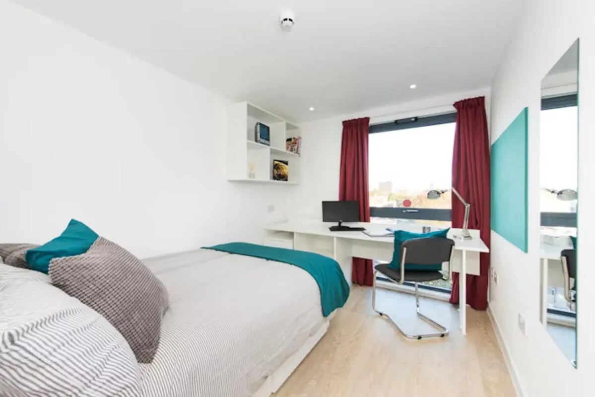 Bed desk computer chair and shelves bedroom at Vincent Place in Southampton Student Accommodation