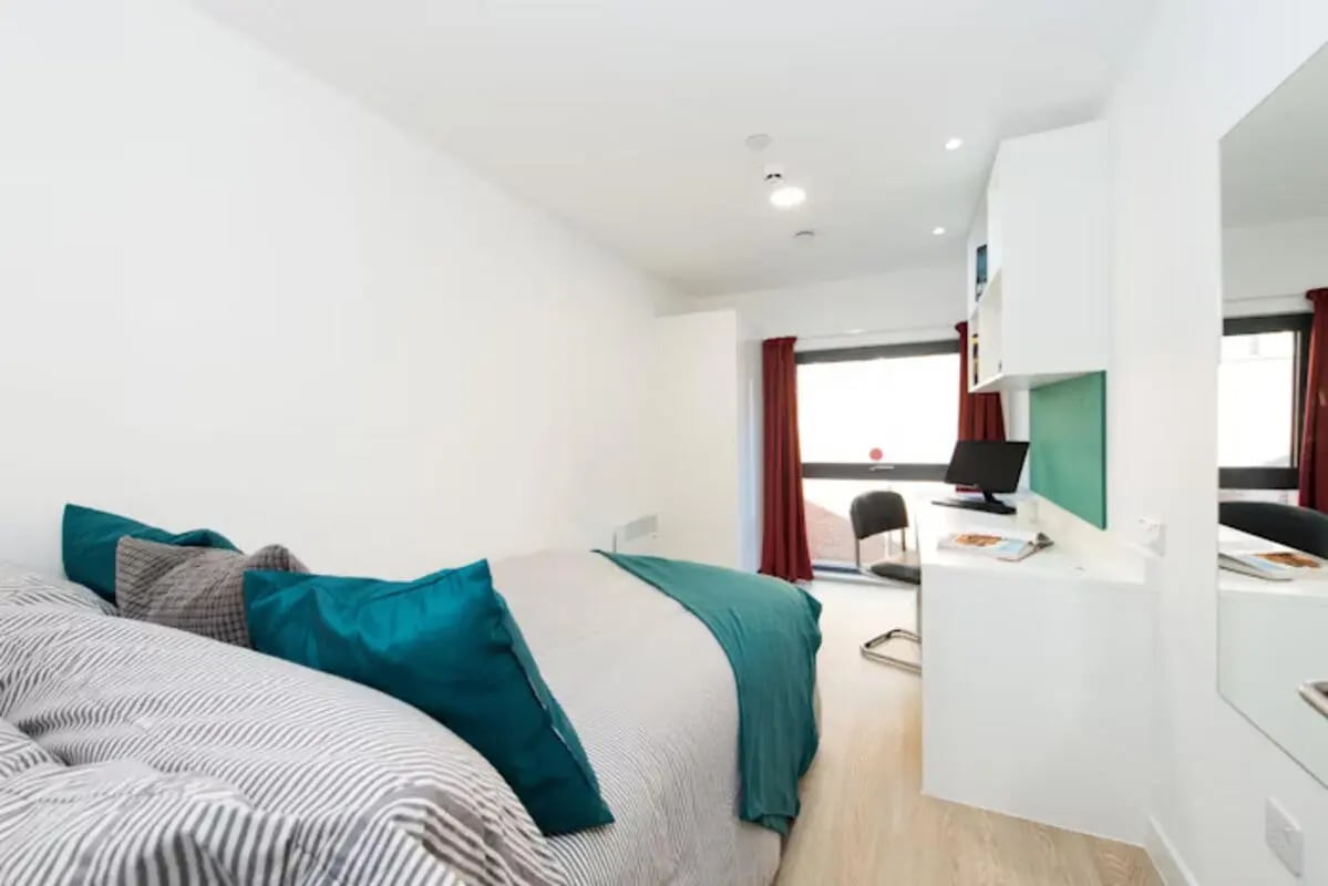 Bed desk with computer and chair bedroom at Vincent Place in Southampton Student Accommodation