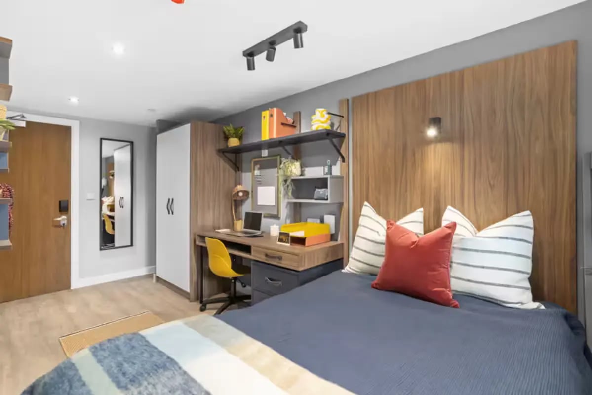 Bed desk wardrobe and mirror bedroom at Brunswick Apartments in Southampton Student Accommodation