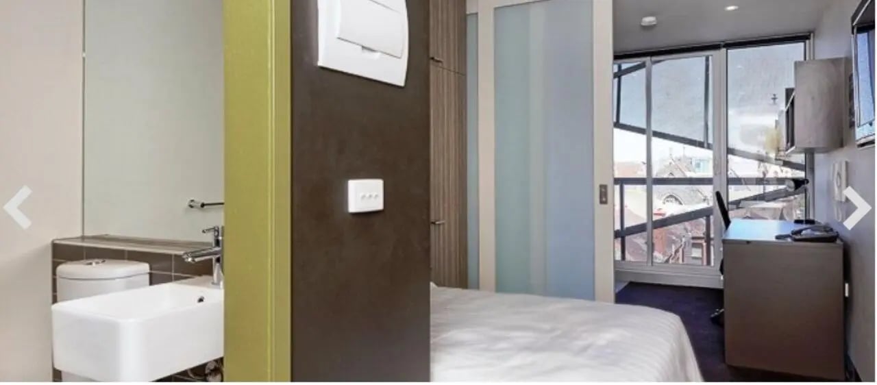 Toilet sink desk with phone bedroom and bathroom at Student Living - Vivida in Melbourne Student Accommodation