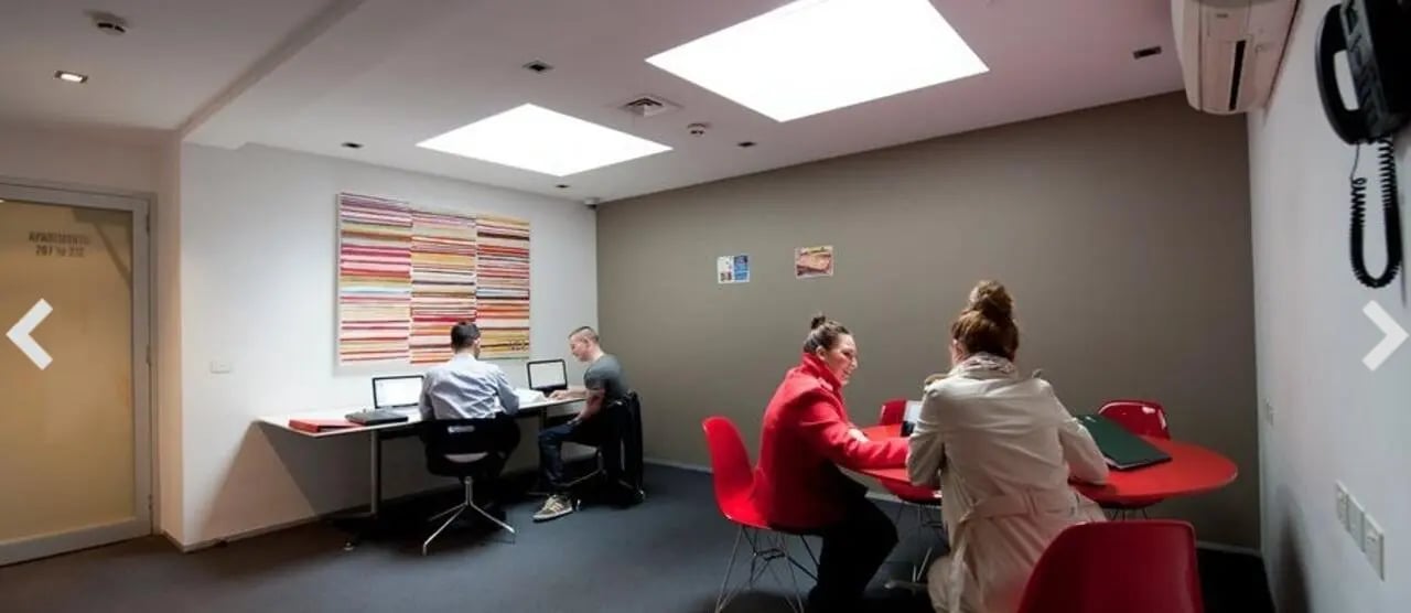 Students working at desks and tables study area at Student Living D1 in Melbourne Student Accommodation