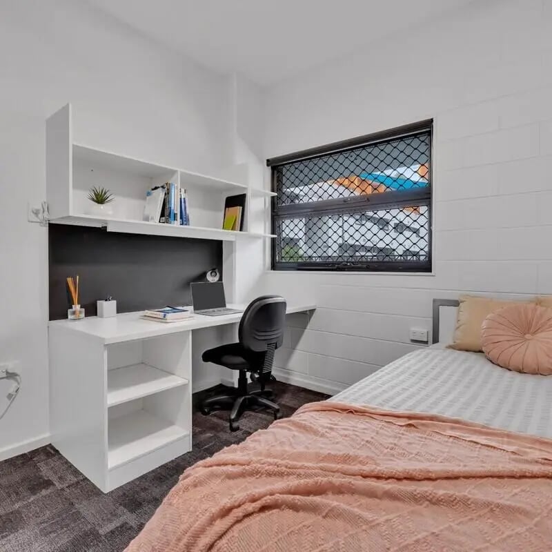 Desk laptop chair shelves bed bedroom at Western Sydney University Village Parramatta Campus in Sydney Student Accommodation
