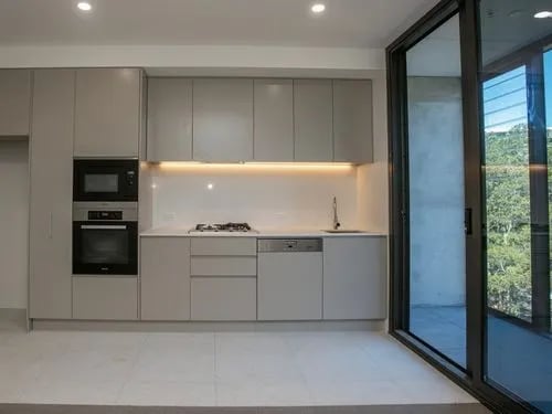 Modern grey kitchen with oven microwave dishwasher kitchen at BELONG Newcastle NSW in Newcastle Student Accommodation