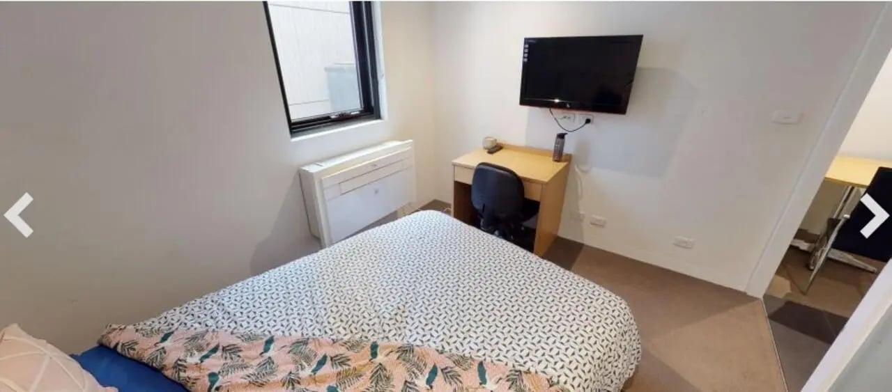 Bed desk television air conditioner bedroom at Student Living on Villiers in Melbourne Student Accommodation