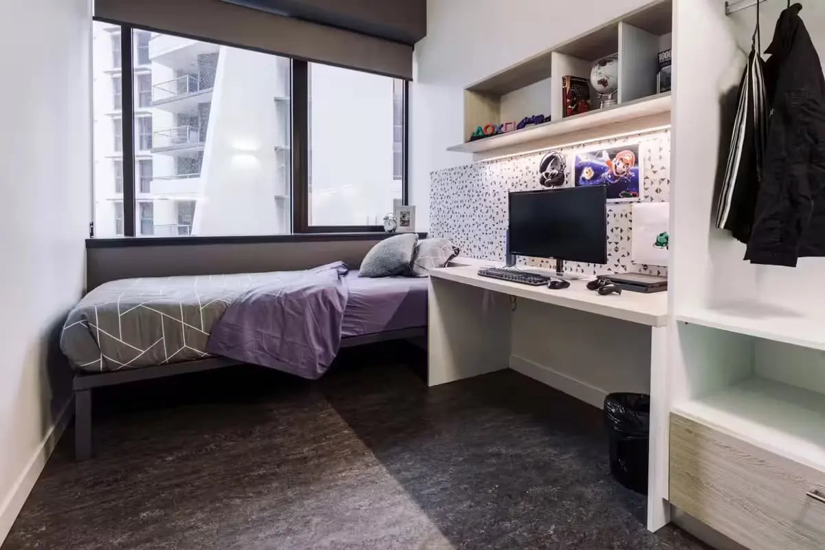 Bed desk computer and shelves student room at Student One Adelaide Street in Brisbane Student Accommodation