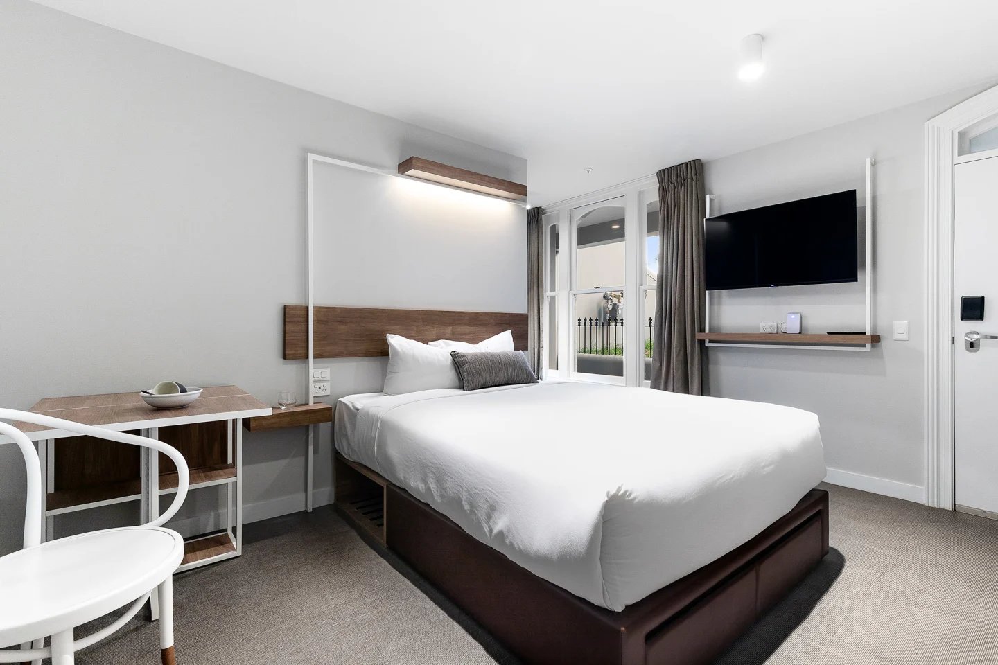 Bed desk chair and TV bedroom at UKO Paddington in Sydney Student Accommodation