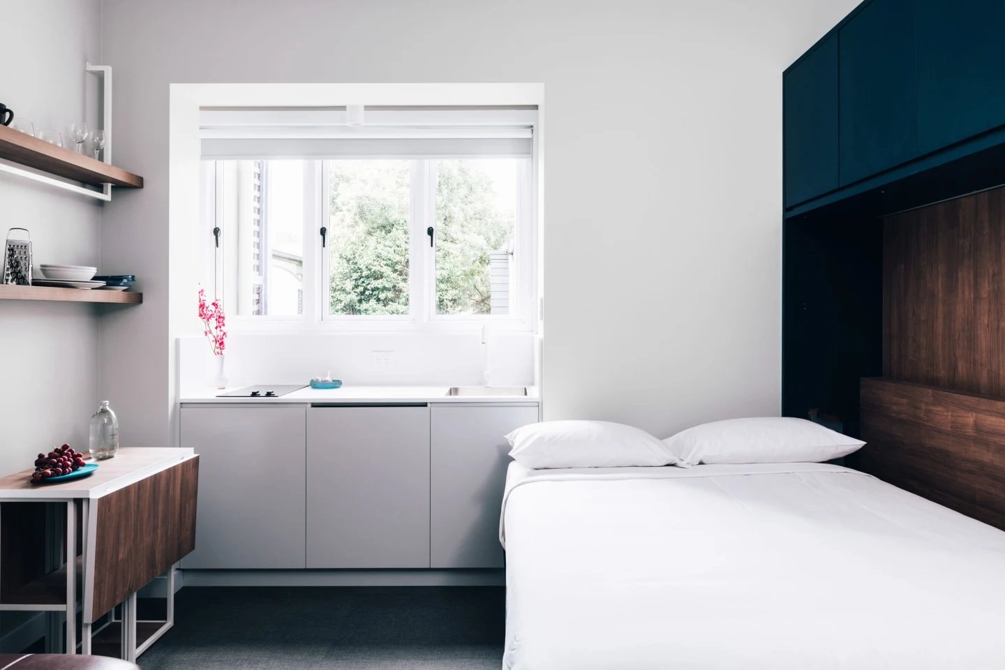 Modern studio with bed kitchen and dining area. at UKO Paddington in Sydney Student Accommodation
