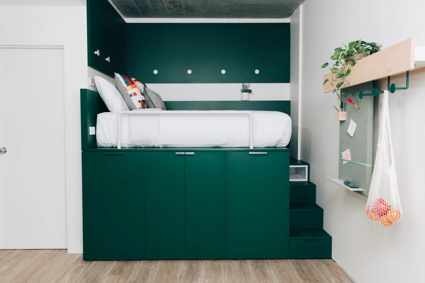 Loft bed with storage drawers and wall organizer Bedroom at UKO Stanmore in Sydney Student Accommodation