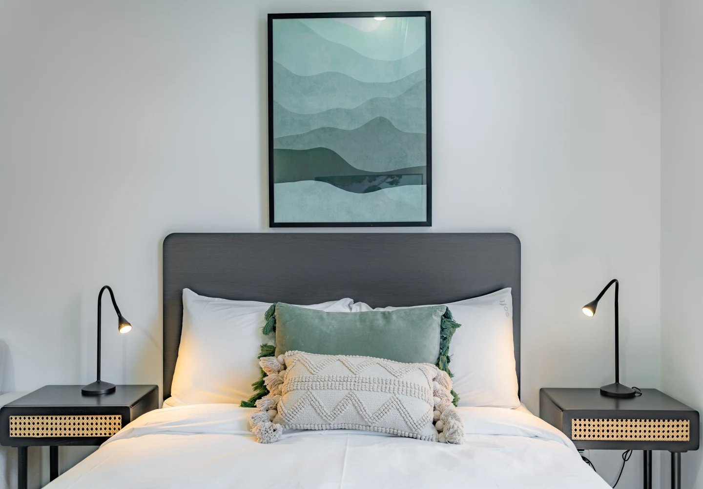 Bed pillows artwork bedside lamps nightstands Bedroom at UKO Sutherland in Sydney Student Accommodation