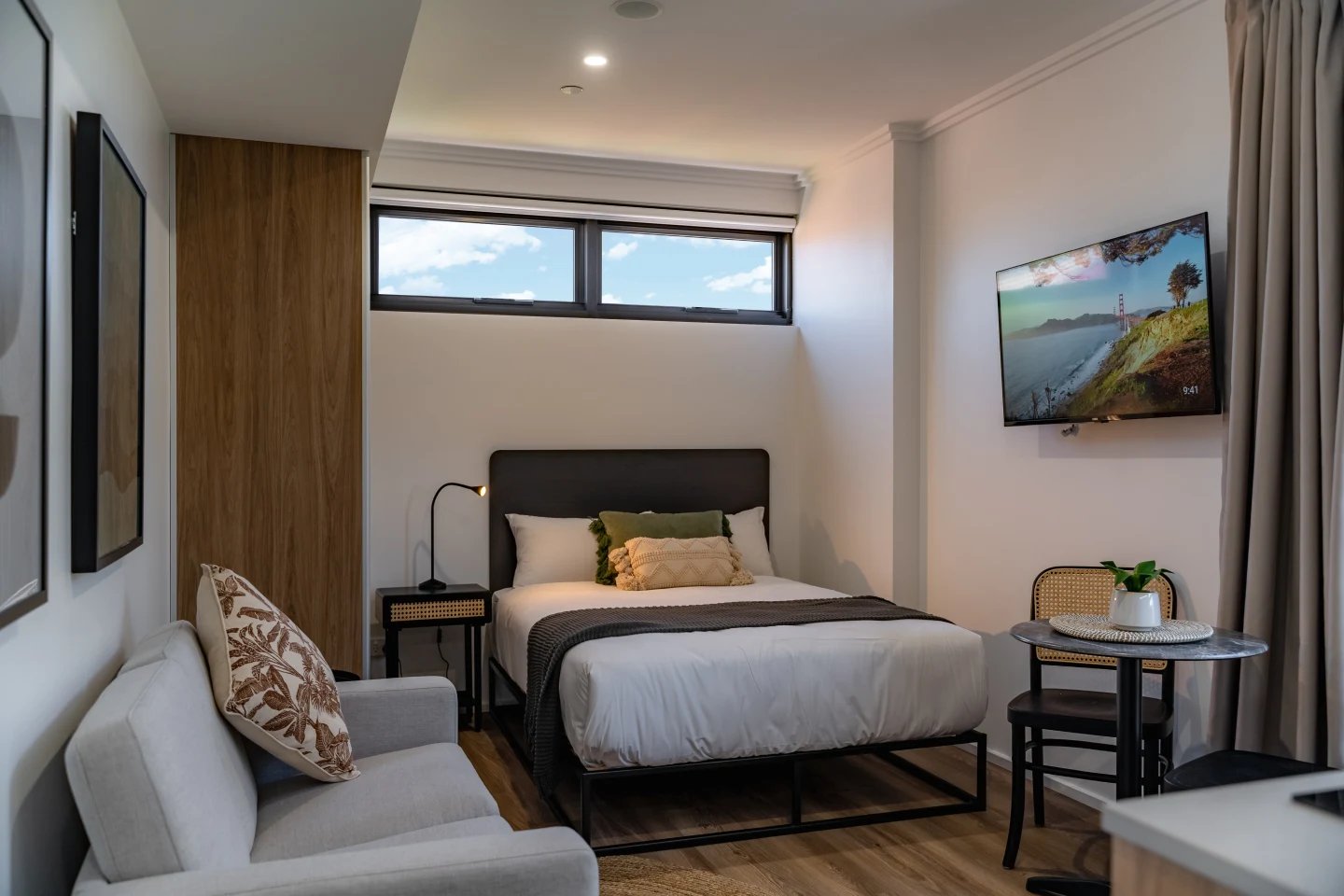 Bed sofa TV table lamp study bedroom at UKO Sutherland in Sydney Student Accommodation