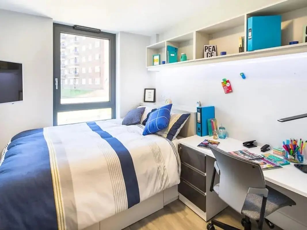 Bed desk shelves and chair bedroom at ViBe Student Living in Kingston Upon Thames Student Accommodation