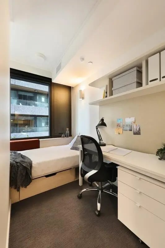 Bed desk chair and window bedroom study area at Iglu Flagstaff Gardens in Melbourne Student Accommodation