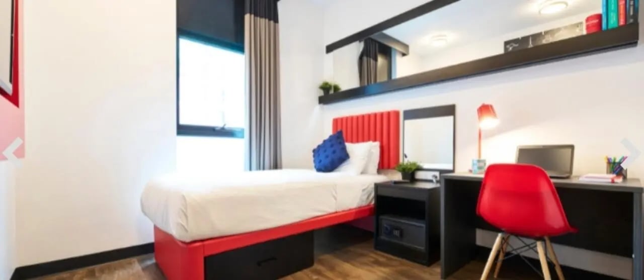 Bed study desk laptop safe bedroom at UniLodge Carlton in Melbourne Student Accommodation