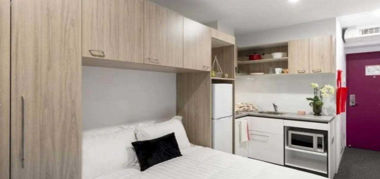 Bed fridge microwave kitchen and doorway at Unilodge South Bank in Brisbane Student Accommodation